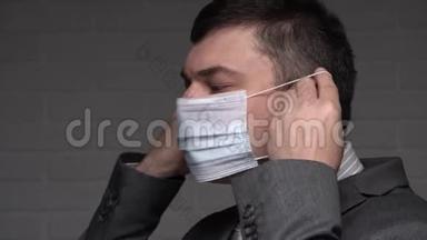 一个男人在脸上戴上防毒面具个人防护-医疗保健和医学概念，预防技巧
